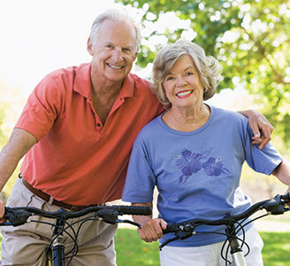 Photo of a couple on bicycles. Link to Life Stage Gift Planner Ages 60-70 Situations.
